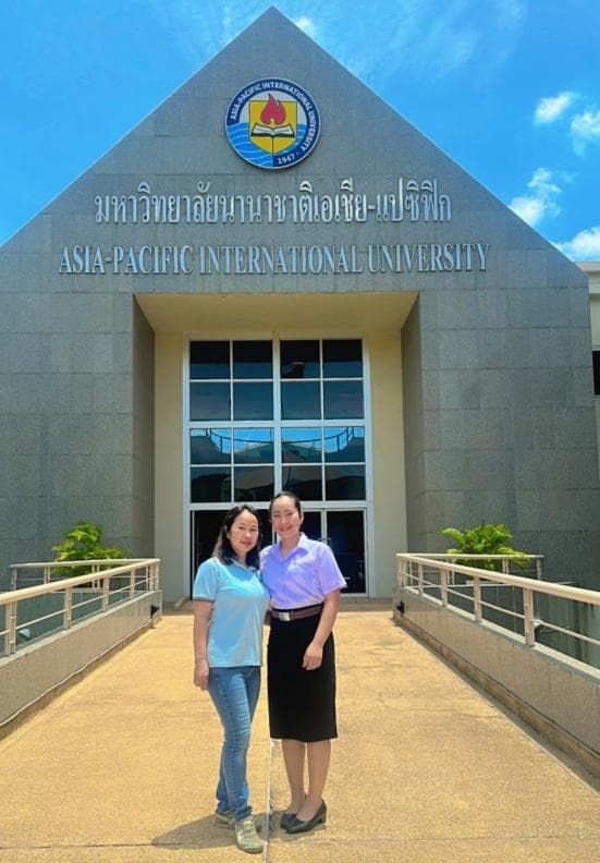 Scholarship student Apinya Sita with Ben, Administration Manager, Good Start, at Asia-Pacific International University
